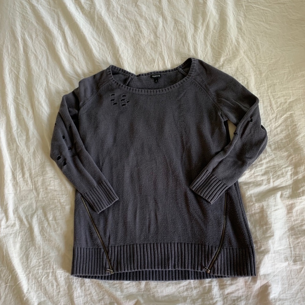 Sweater made to look worn